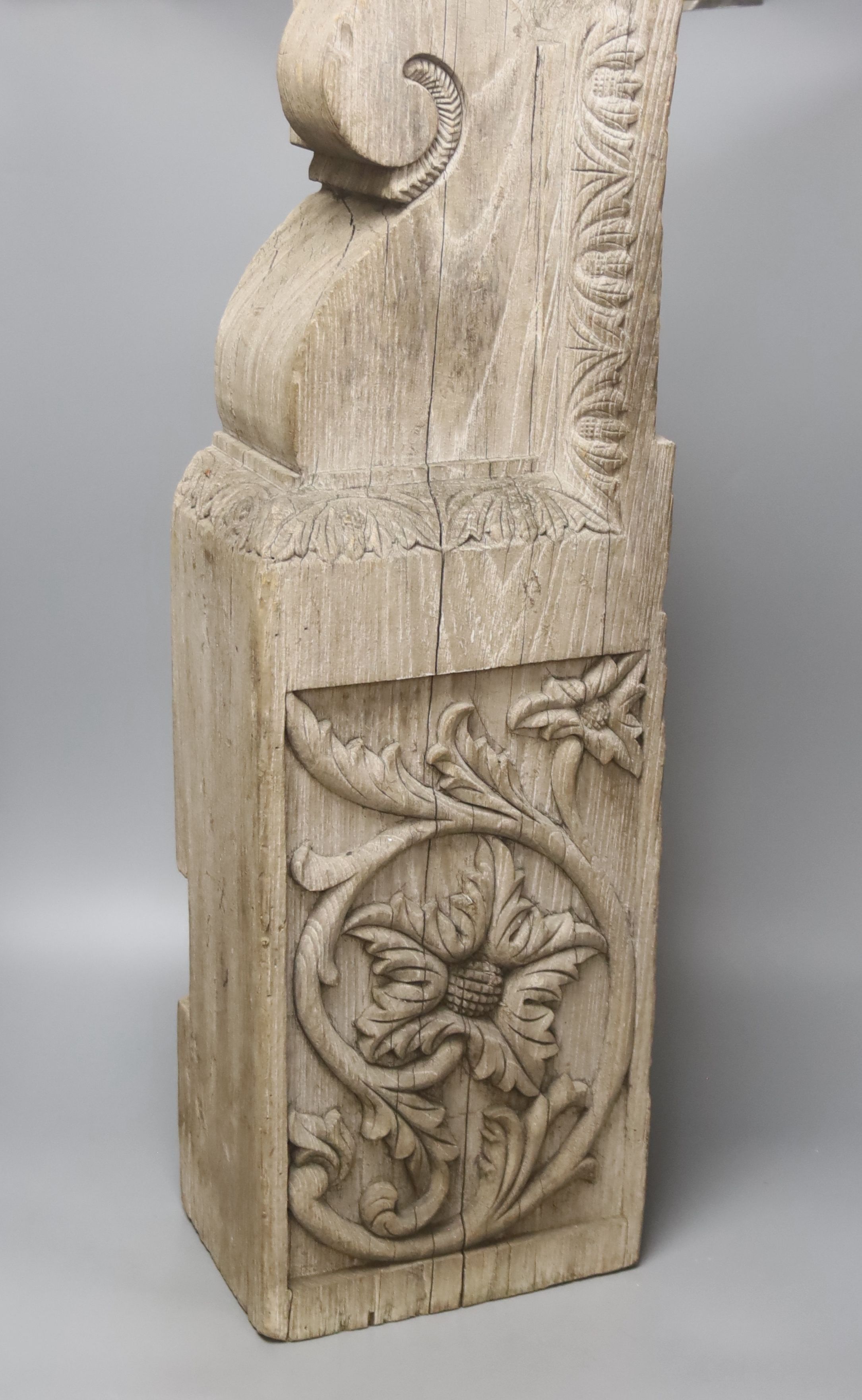 A sculpted stone pot labelled This Stone came from The Houses of Parliament, 15 x 15cm 19cm high, a teak architectural support, 18th century